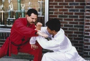 Shifu Jack demonstrating a self-defense technique outside the school